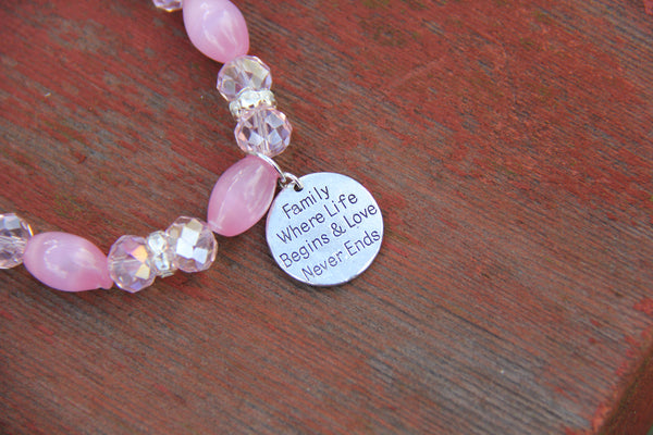  Pink glass beads and a silver charm for bottle bracelet