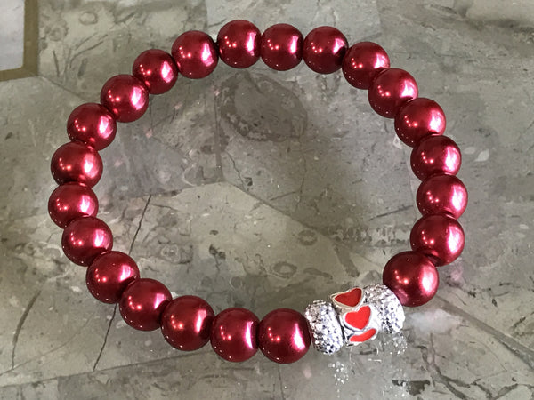 Red pearl glass beads bracelet with an European hearts charm